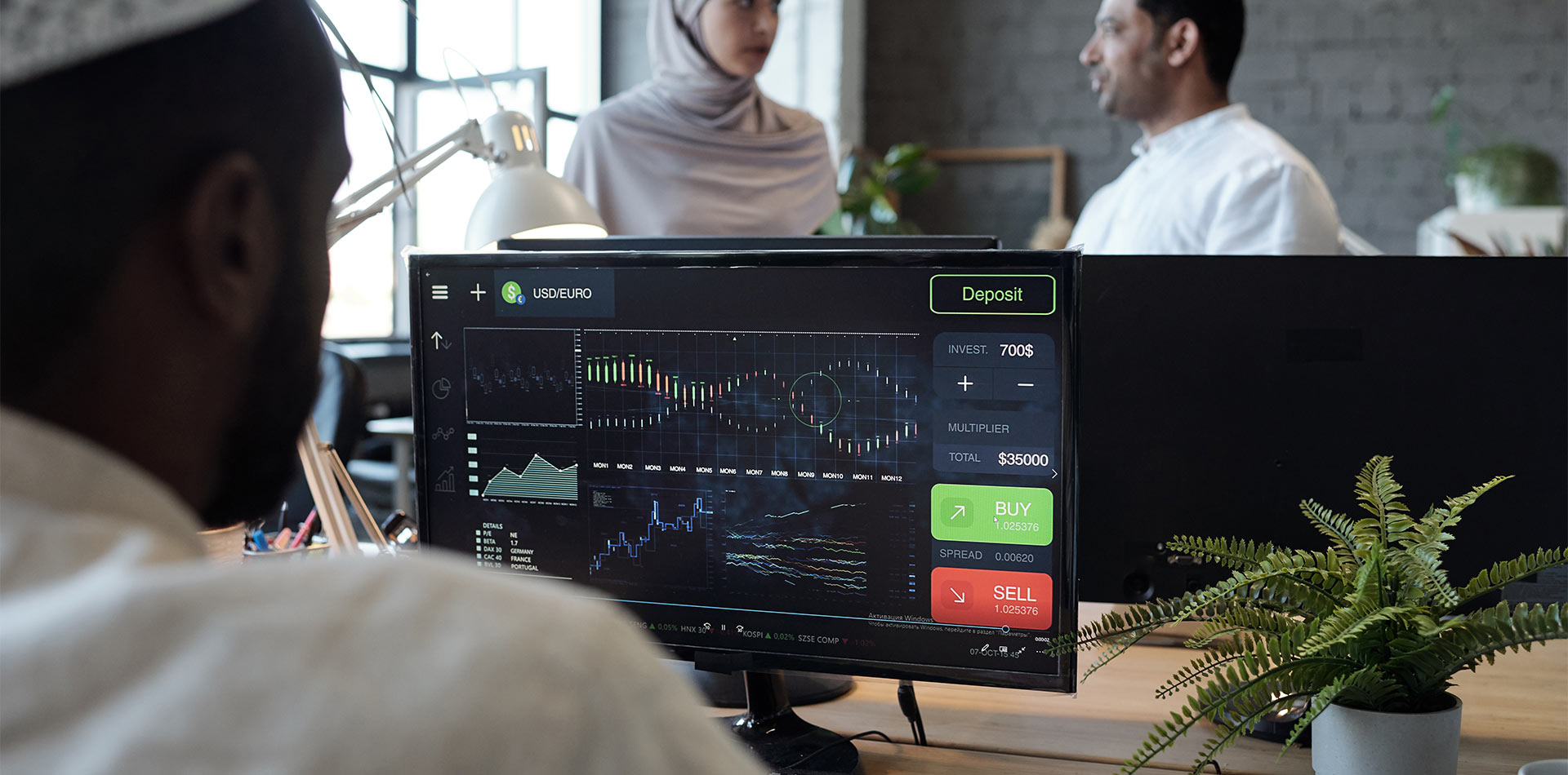 Trader opening a demo forex account on a laptop